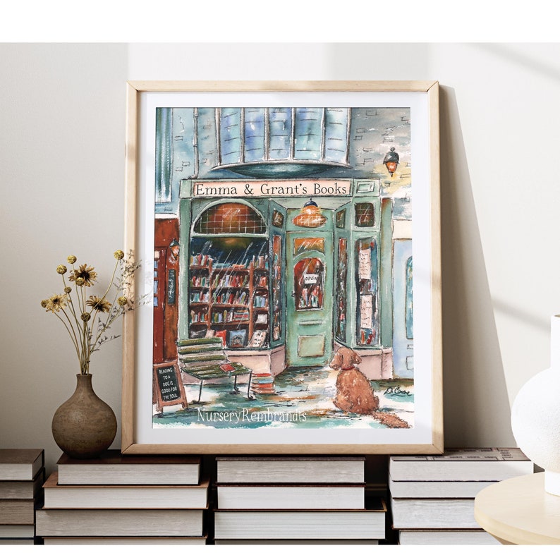May include: A watercolor painting of a bookstore with a green door and a sign that reads "Emma & Grant's Books". A dog sits outside the store. The painting is signed "Nursery Remnants".