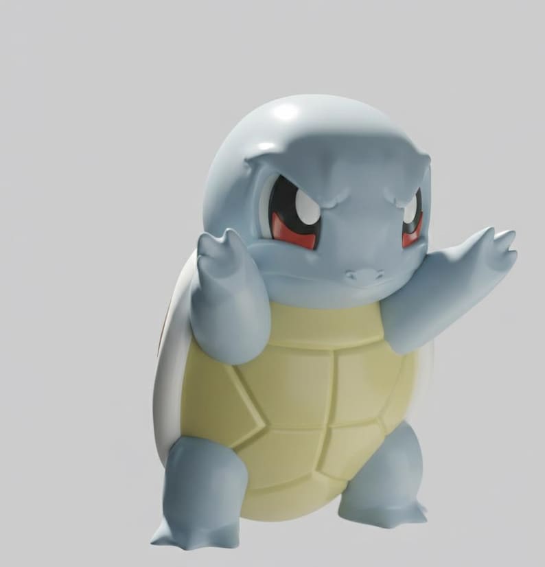 Op de afbeelding: Een lichtblauwe Squirtle-figuur met een gele schild. De figuur heeft rode ogen en poseert met de armen omhoog. De figuur is een gestileerde weergave van het populaire Pok&eacute;mon-personage.