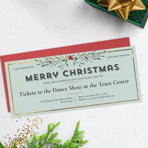 May include: A Christmas gift certificate with the text "MERRY CHRISTMAS" and "Tickets to the Dance Show at the Town Center." The certificate is on a red envelope, with a green gift box and gold bow in the background.