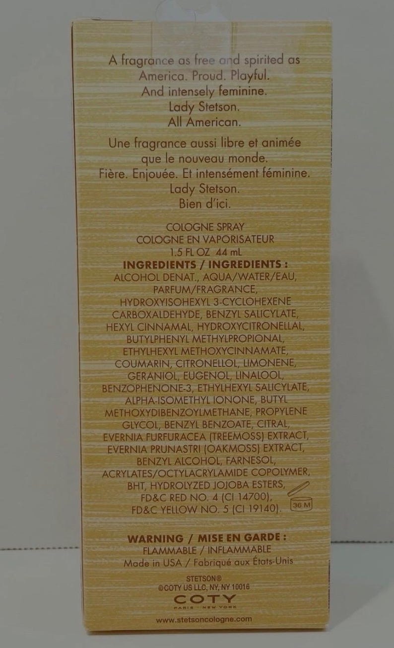 May include: A product label for Lady Stetson cologne. The label is beige with black text, including the brand name, product type, ingredients, and a warning about flammability. The bottle contains 1.5 fl oz, equivalent to 44 ml.