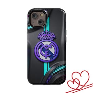 May include: Black phone case featuring a purple and white team logo with a crown. The case has a textured design with teal and purple accents. The phone's camera is visible at the top.