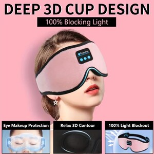 May include: A pink eye mask with a black trim and the text "Enjoying" and "DEEP 3D CUP DESIGN 100% Blocking Light". The mask is designed for eye makeup protection, 3D contour relaxation, and 100% light blackout.