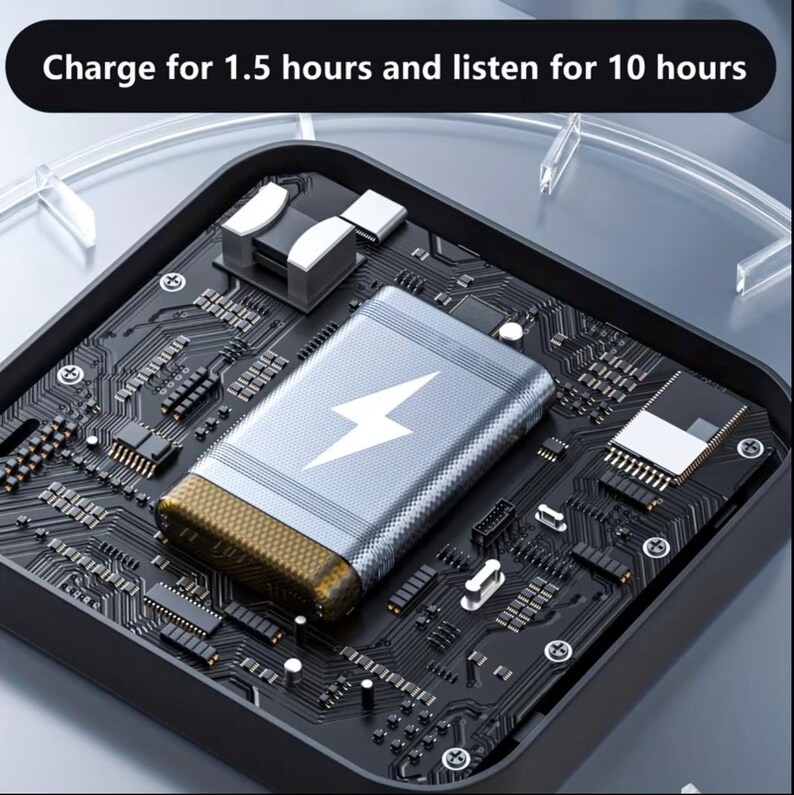 May include: A silver and gold power bank with a white lightning bolt symbol, resting on a black circuit board. The text at the top reads, "Charge for 1.5 hours and listen for 10 hours."