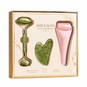 May include: A skincare set in a gold-trimmed box labeled JADE & GLOW LUXURY SKINCARE DUO. It contains a green jade facial roller with gold metal hardware, a green heart-shaped gua sha tool, and a light pink ice roller for cooling and depuffing.