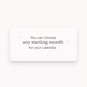 May include: A white rectangular card with rounded corners features the text "You can choose any starting month for your calendar." in a simple, modern font. Small starburst graphics accent the text. The card is set against a plain white background.