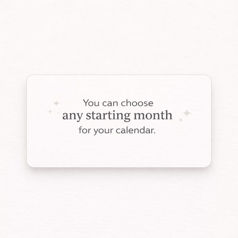May include: A white rectangular card with rounded corners features the text "You can choose any starting month for your calendar." in a simple, modern font. Small starburst graphics accent the text. The card is set against a plain white background.