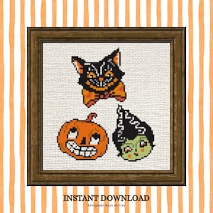 May include: A cross-stitch pattern featuring a black cat, an orange jack-o'-lantern, and a green-skinned character with black hair in a dark wooden frame. The text INSTANT DOWNLOAD and Keeepsake Kays on Etsy appear at the bottom of the image.