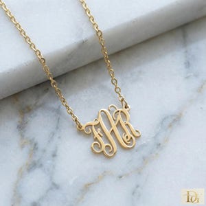 May include: A set of three ceramic mugs with a speckled, matte finish in cream, light grey, and dark grey. Each mug has a simple, minimalist design, ideal for coffee or tea.