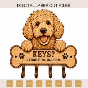 May include: A digital laser cut file design featuring a light brown, fluffy dog resting its paws on a bone-shaped wooden key holder. The sign displays the text KEYS? I THOUGHT YOU HAD THEM. and includes four dark brown hooks for hanging items.