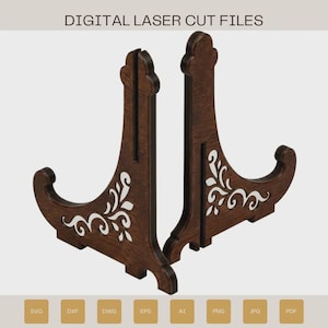May include: Two dark brown wooden display stands featuring intricate white floral cutouts. The stands have a vertical slot and a curved base. The text DIGITAL LASER CUT FILES is at the top, with SVG, DXF, DWG, EPS, AI, PNG, JPG, and PDF labels below.