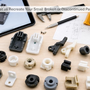 May include: An assortment of small, plastic replacement parts in various shapes and colors, including black, white, and beige. The image includes a tablet, calipers, and a pen, with the text "Let us Recreate Your Small Broken or Discontinued Part".