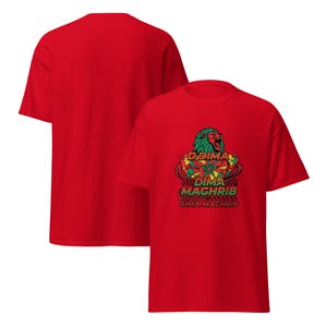 May include: Red t-shirt featuring a graphic design with a lion, the text "Dima Maghrib", and a checkered pattern. The design incorporates green, yellow, and red colors. The back of the shirt is plain red.
