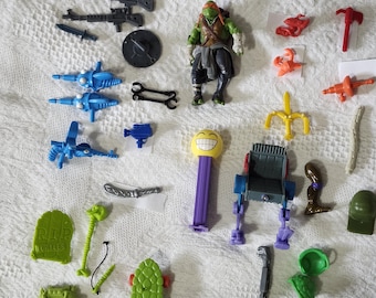 Vintage TMNT Teenage Mutant Ninja Turtles LOT: Accessories, Weapons, Parts, 80's-90's + 2012 Playmates Figure