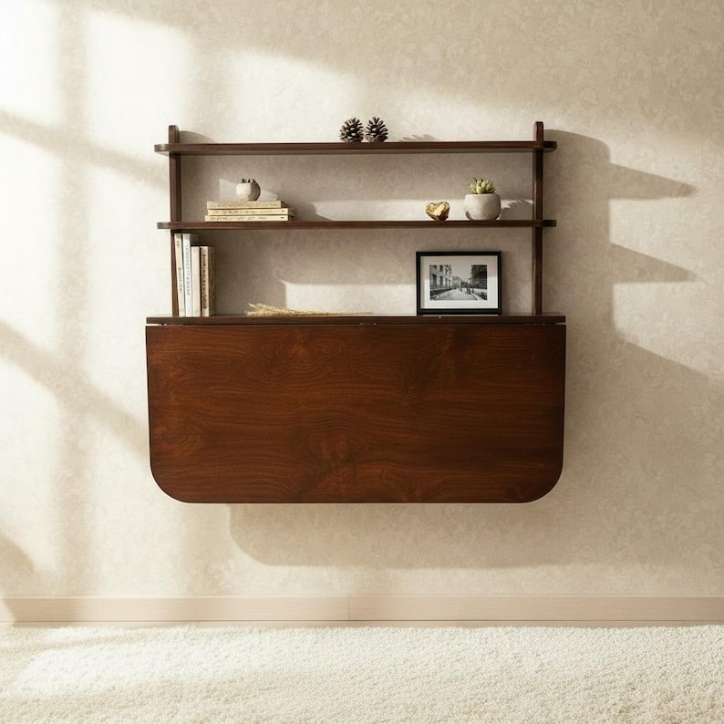Wall mounted folding desk with shelves.