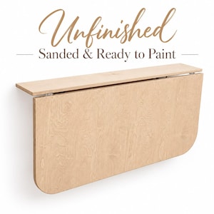 May include: A wall-mounted, unfinished light wood drop-leaf table with rounded corners and metal hinges. The text above the table reads: Unfinished Sanded & Ready to Paint. The surface is smooth, light-colored plywood with visible wood grain.