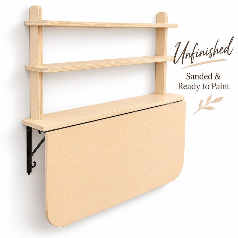 May include: A wall-mounted light wood desk with two upper shelves and a drop-leaf table surface supported by black metal brackets. The wood is unfinished, sanded, and ready to paint. Text on the image reads: Unfinished, Sanded & Ready to Paint.