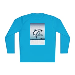 May include: A long-sleeve, turquoise shirt featuring a graphic of a leaping tarpon fish. The graphic includes the text "Boca Grande Tarpon Capital" in a white font. The shirt is made of a lightweight material.