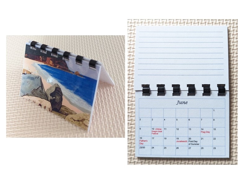May include: A small desk calendar with a spiral binding. The calendar shows the month of June with a beach scene on the cover. The calendar is open, displaying the days of the month and lined paper.