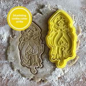 May include: A white ceramic mug with a black handle and the text "But First, Coffee" in a bold, black font. The mug is set against a blurred background, suggesting a cozy setting.