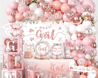 May include: A baby shower decoration set featuring a balloon arch in shades of pink, white, and rose gold, with clear boxes spelling GIRL, floral plates, a cake topper, and a banner with the text It's a Girl and Mom to be in pink tones.