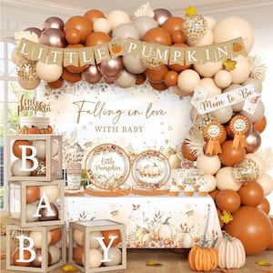May include: A baby shower party set featuring a balloon arch in shades of orange, cream, and metallic copper, a banner reading LITTLE PUMPKIN, and four clear boxes with white letters spelling BABY. Includes plates, cups, and table decor.