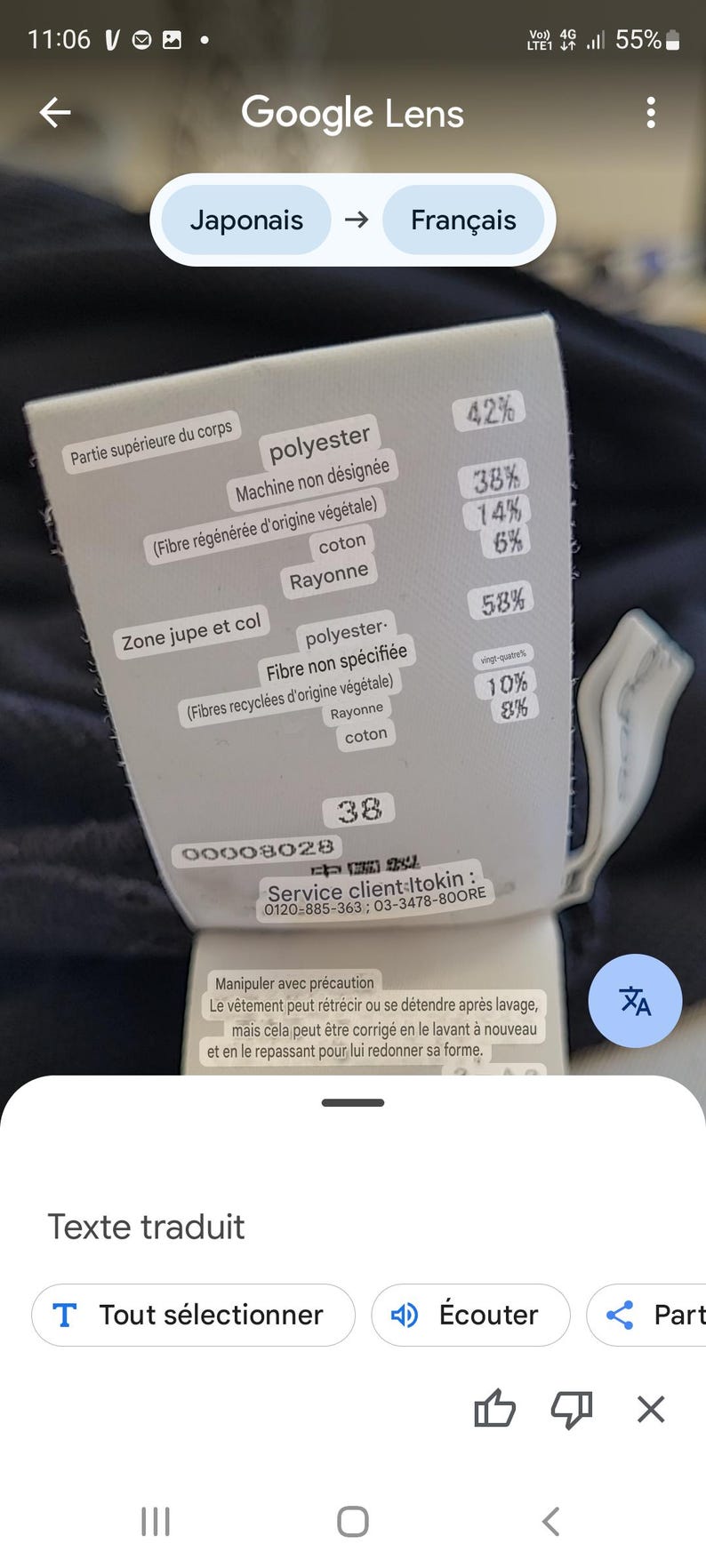 May include: A clothing tag with text in French and Japanese, showing fabric composition percentages. The tag lists materials like polyester, cotton, and rayon. It also includes care instructions and a size 38.