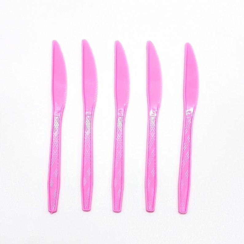 May include: A white ceramic mug with a black handle and the text "But First, Coffee" in a black, bold font. The mug is on a white surface. The mug is approximately 4 inches tall.