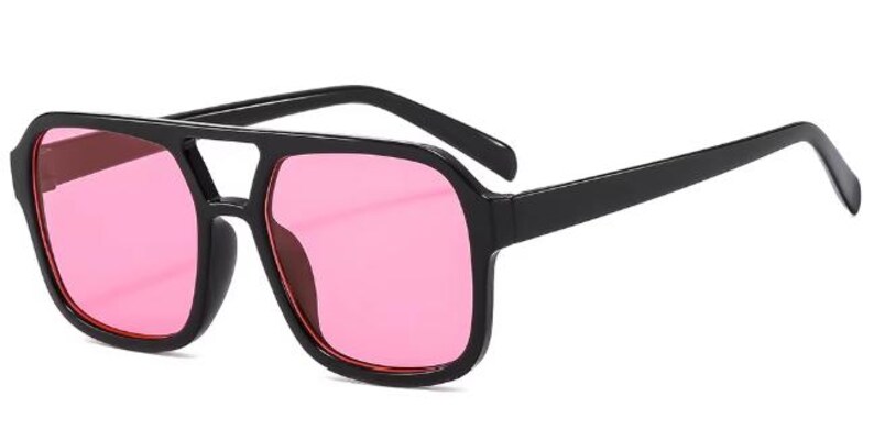 May include: Black square-framed sunglasses with pink lenses. The sunglasses have a double bridge and thick arms. The lenses are a vibrant pink colour, and the frames are a solid black.