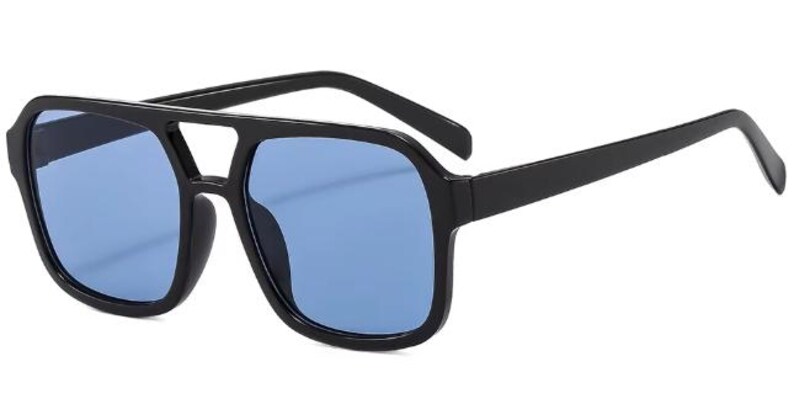 May include: Black square sunglasses with blue lenses. The sunglasses feature a double bridge and thick arms. The lenses are a solid blue, and the frames have a matte black finish. A stylish accessory for eye protection.