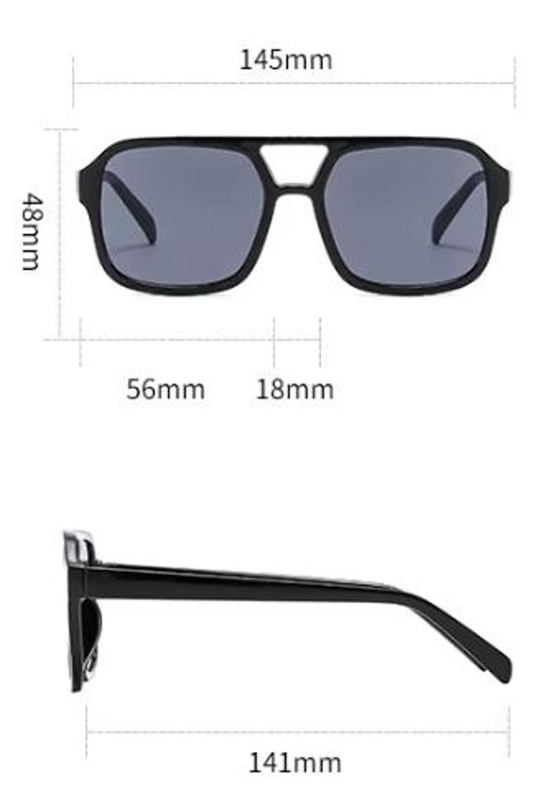 May include: Black square sunglasses with grey lenses. The sunglasses measure 14.5cm wide, 4.8cm high, and 14.1cm long. The lenses are 5.6cm wide with an 1.8cm bridge. The sunglasses have a double bridge design.