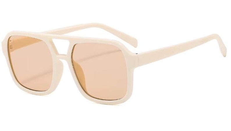 May include: Cream-coloured sunglasses with a square frame and peach-tinted lenses. The sunglasses have a double bridge and thick temples. The overall design is retro-inspired, offering a bold and stylish look.