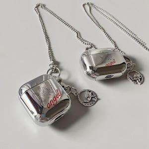 May include: Two silver-toned metallic cases for wireless earbuds, each featuring a printed graphic of two cherubs and the word "angel" in red script. Each case includes a matching silver ball chain lanyard and a circular charm with a cherub motif.