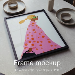 May include: A black framed wall art print featuring a stylized illustration of a figure with blonde hair in a ponytail, wearing lime green sunglasses and a pink coat with orange polka dots, holding a black handbag. Text reads Frame mockup.