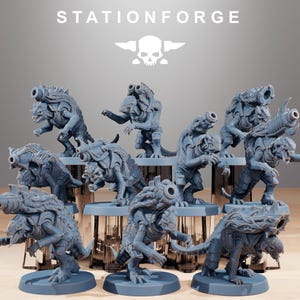 May include: A collection of gray miniature figurines of alien creatures with weaponized appendages. The figurines are posed in various stances, with detailed armor and weaponry. The text "STATIONFORGE" and a skull logo are visible at the top.
