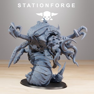 May include: A gray, detailed miniature creature with multiple limbs, horns, and a segmented body, mounted on a black base. The word "STATIONFORGE" is printed above the creature.
