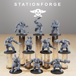 May include: A collection of gray miniature figurines of Orcs, each posed with weapons and armor. The figurines are displayed on clear cylindrical stands. The text "STATIONFORGE" and a skull logo are at the top.
