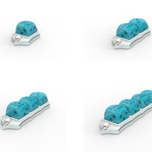 May include: A collection of dice in various arrangements. The dice are a light blue color with a textured surface. They are set in a white tray with a skull design on the end. The dice are designed for tabletop gaming.