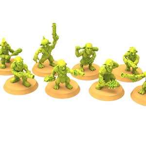 Puede incluir: Un conjunto de diez figuras de fantasía en miniatura verdes, cada una posada sobre una base circular de color beige. Las figuras están en varias poses de acción, algunas sosteniendo armas. Ideal para juegos de mesa o coleccionar miniaturas.