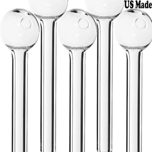 May include: A collection of six clear glass oil burners. Each burner has a round bulb at the top with a small hole and a long, slender stem. The image includes a US Made label with the American flag.