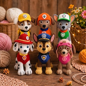 May include: Six handmade crochet amigurumi figures representing characters from Paw Patrol. The set includes dogs in various colors wearing hats and uniforms with embroidered badges, featuring detailed yarn textures and stitched facial expressions.