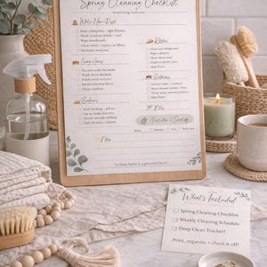 May include: A wooden clipboard with a spring cleaning checklist, with sections for different areas of the home. A small card lists included items. Other items include a spray bottle, towels, and a candle.