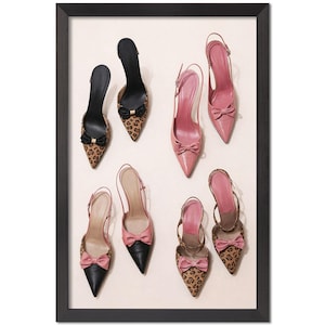 May include: An assortment of high-heeled shoes in a framed display. The shoes feature pointed toes, bows, and slingback straps. Some have a leopard print pattern, while others are solid pink or black.