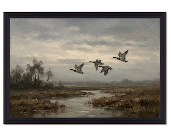 May include: A framed landscape painting depicting four ducks in flight over a marshy wetland area with a winding stream. The scene features a muted color palette of browns, grays, and soft whites under a cloudy, overcast sky with distant trees.