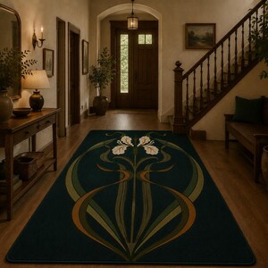 May include: A rectangular area rug featuring a dark green background with a central symmetrical floral motif in shades of cream, olive green, and burnt orange. The design displays stylised iris flowers with long, flowing stems and leaves.