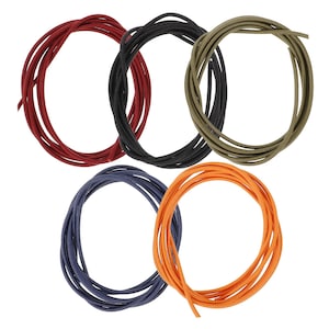 May include: Five coiled cords in various colors: red, black, olive green, navy blue, and orange. Each cord is tightly wound, creating a circular shape. The cords are likely made of a flexible material, suitable for crafting or other uses.