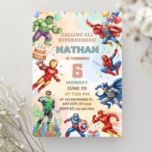 May include: A birthday invitation card featuring illustrations of Hulk, Thor, Iron Man, Spider-Man, Batman, Green Lantern, Captain America, and The Flash. The text reads: CALLING ALL SUPERHEROES! NATHAN IS TURNING 6 MONDAY JUNE 20 AT 7:00 PM AT 123 ANYWHERE ST., ANY CITY, ST 12345 RSVP AT: 123 456 7890.