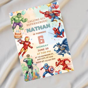 May include: A rectangular birthday invitation card featuring colorful illustrations of various superheroes including Hulk, Thor, Spider-Man, Iron Man, Batman, Green Lantern, Captain America, and The Flash, with text reading CALLING ALL SUPERHEROES! NATHAN IS TURNING 6.