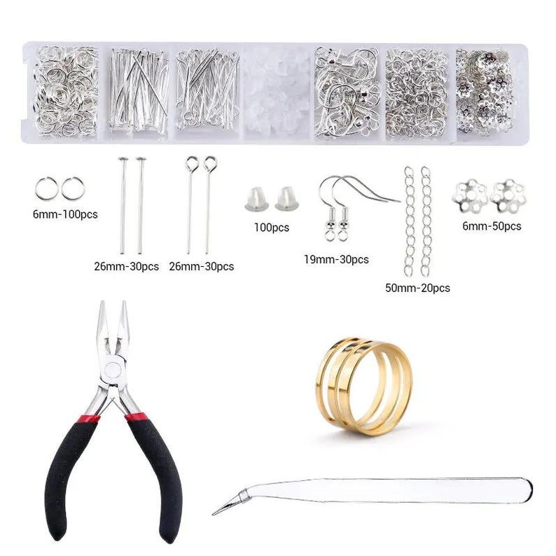 May include: A jewelry making kit featuring a clear plastic organizer box filled with silver-toned jump rings, head pins, eye pins, earring hooks, chains, and flower beads. Includes a pair of black-handled pliers, a gold-toned ring, and tweezers.