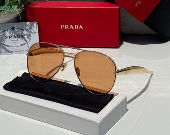 Gafas de sol vintage PRADA negras y doradas