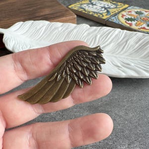 Pomello per mobile a forma di ala in bronzo – Ferramenta in lega (54 x 23 mm) - XBYZ025
